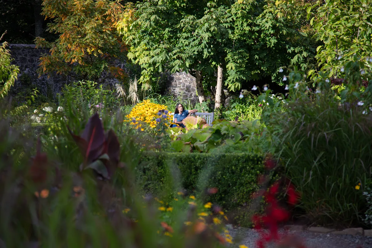 Woman sitting in Dunvegan Castle and Gardens