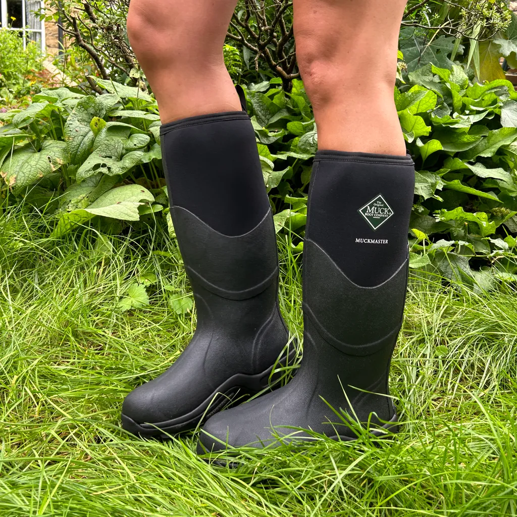Woman wearing Muck Boots on grass