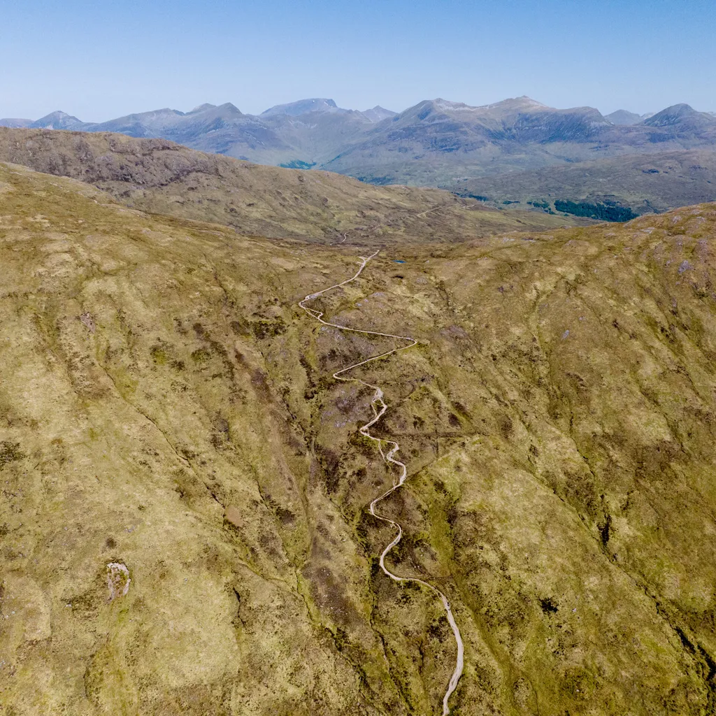 Devil's Staircase on the West Highland Way with blue sky and mountains