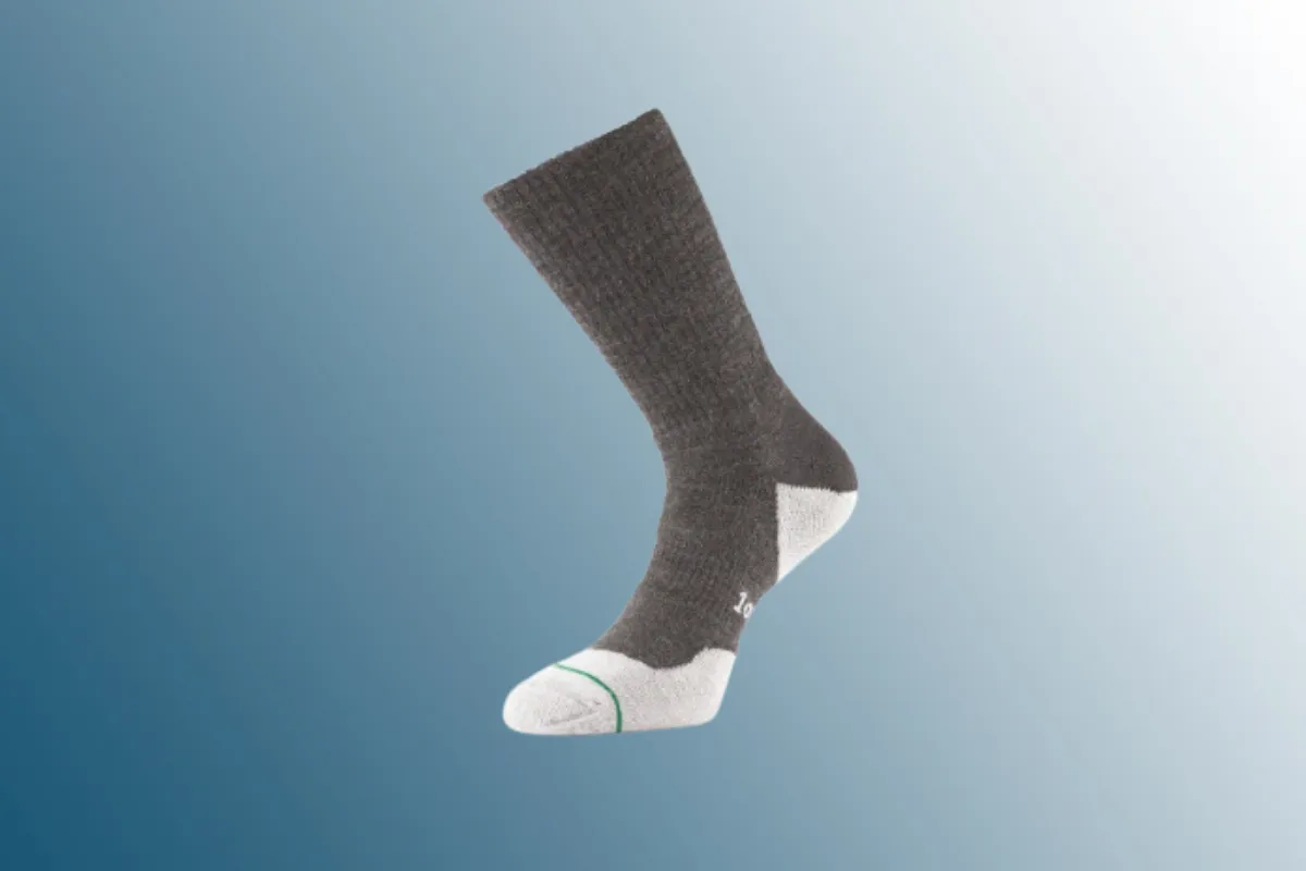 Grey and white sock on blue background 