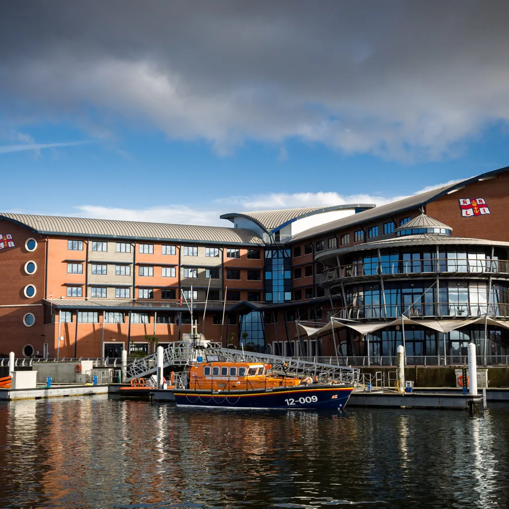 Landscape shot of the RNLI College in Poole taken from Holes Bay