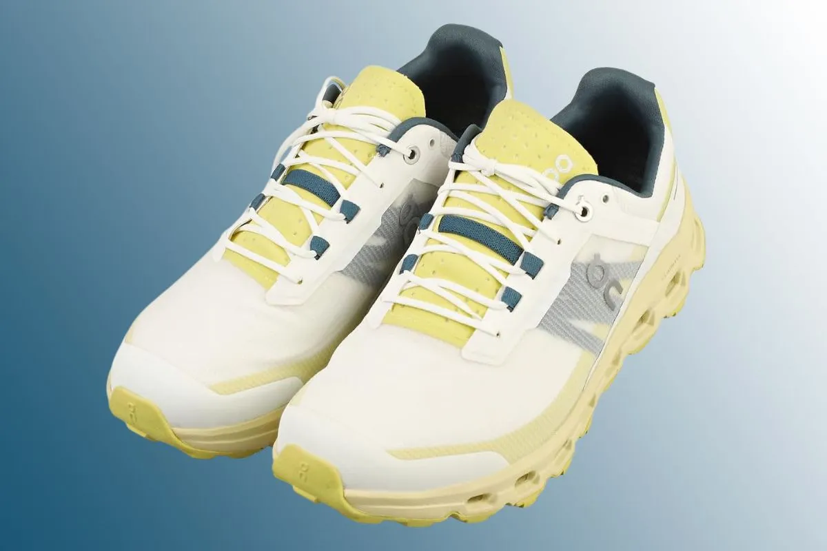 White trail running shoes on blue background 