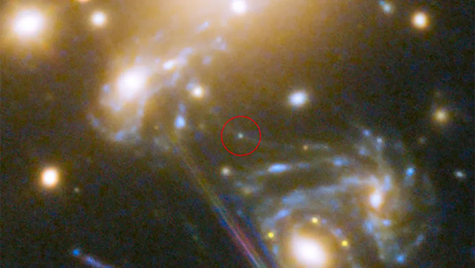 This image shows a section of the galaxy cluster in which the star was discovered. Circled in red is the position where the star appeared.Credit: NASA, ESA, S. Rodney (John Hopkins University, USA) and the FrontierSN team; T. Treu (University of California Los Angeles, USA), P. Kelly (University of California Berkeley, USA) and the GLASS team; J. Lotz (STScI) and the Frontier Fields team; M. Postman (STScI) and the CLASH team; and Z. Levay (STScI)