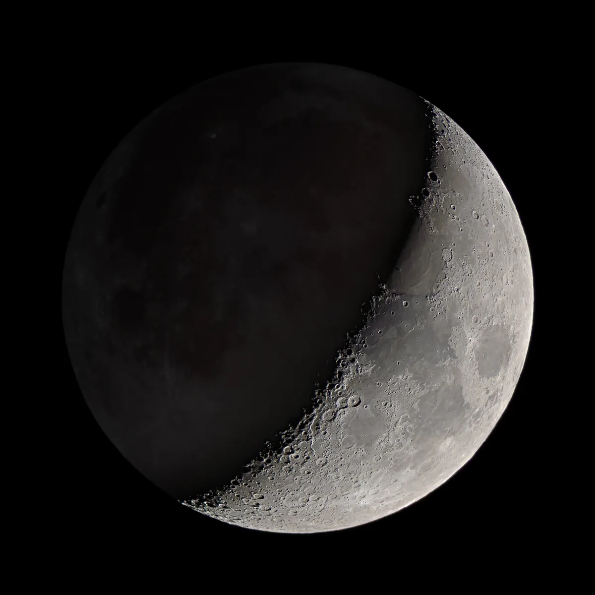 Moon with Earthshine by Tom Howard, Crawley, West Sussex, UK. Equipment: Nikon D7000, Meade 5000 127mm refractor, Skywatcher AZ-EQ6 mount.