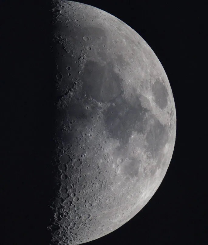 First Quarter Moon by Tom Chitson, Woking, Surrey, UK. Equipment: Sky Watcher Evostar 80ED, Nikon D3000, EQ3-2 Mount