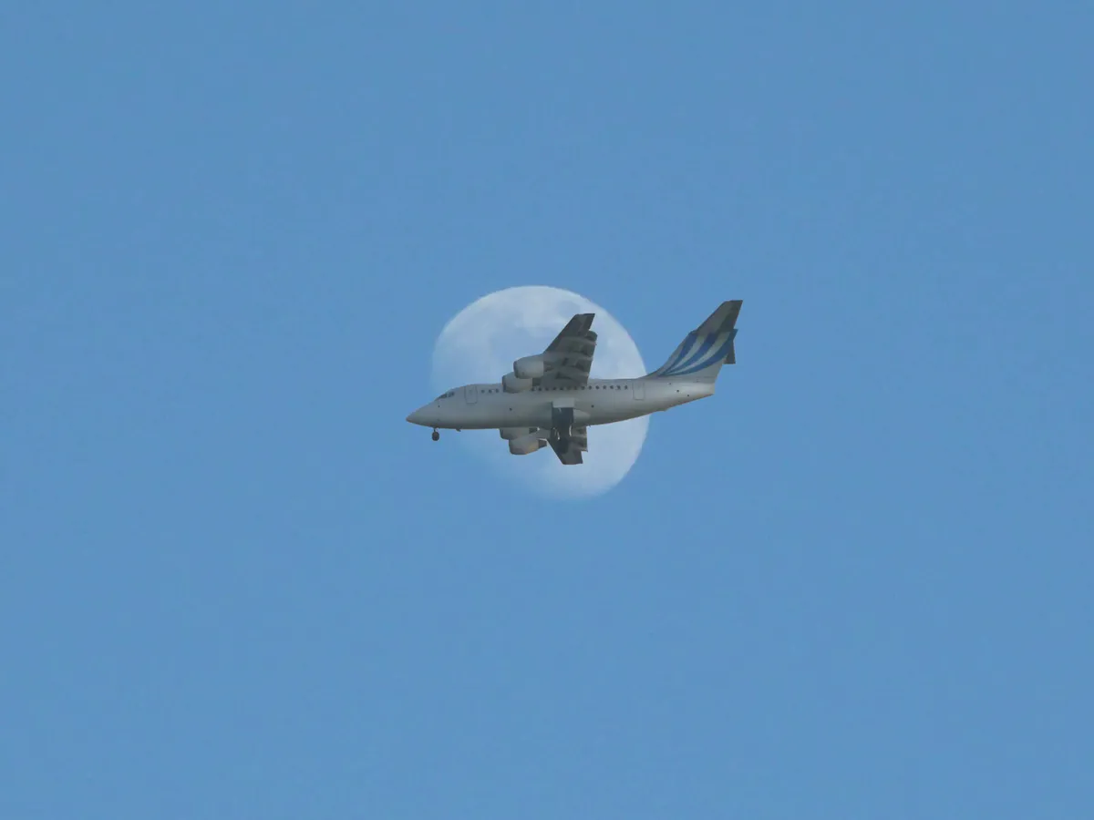 Airplane/Moon by Martin, Southampton, UK. Equipment: Panasonic TZ3.