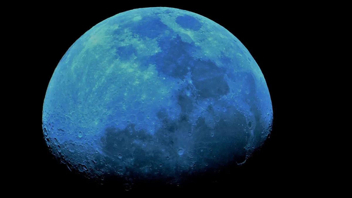 Moon with a Blue Filter by Anthony Taylor, Surrey, UK. Equipment: Celestron Nexstar 4SE, Nikon D1000, T adapter.