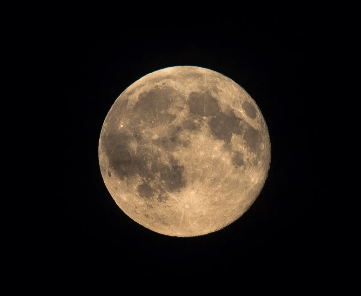 A 'blue Moon' - the second full Moon in a calendar month, appears over Bedfordshire, UK, 31 July 2015, imaged by Roger Skillin with a Nikon D610 DSLR camera and Sigma 120-400mm APO VR lens.