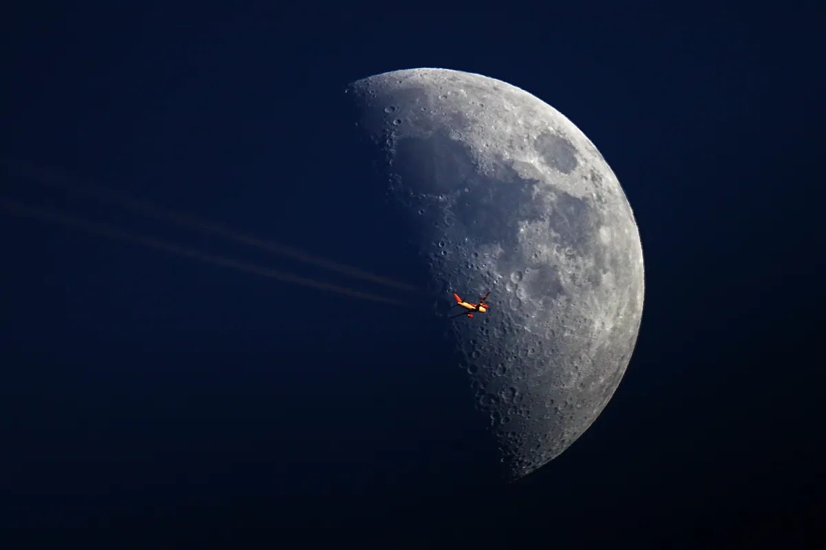 Plane over Moon by Jody Walmsley, Radcliffe, Manchester, UK. Equipment: Skywatcher 250, EQ6, Canon 500D