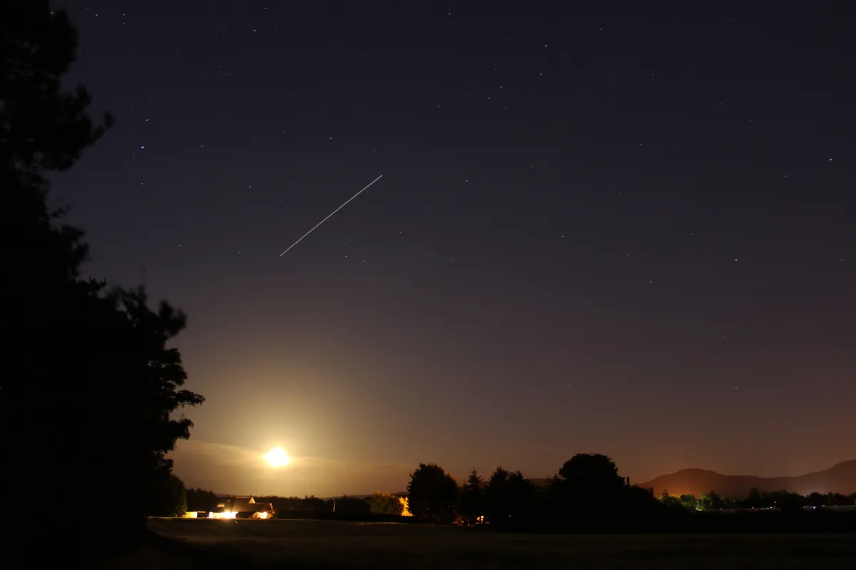 ISS and the Rising Moon by Steve Brown, Stokesley, N. Yorkshire, UK. Equipment: Canon 600D, 18-55mm lens, static tripod.