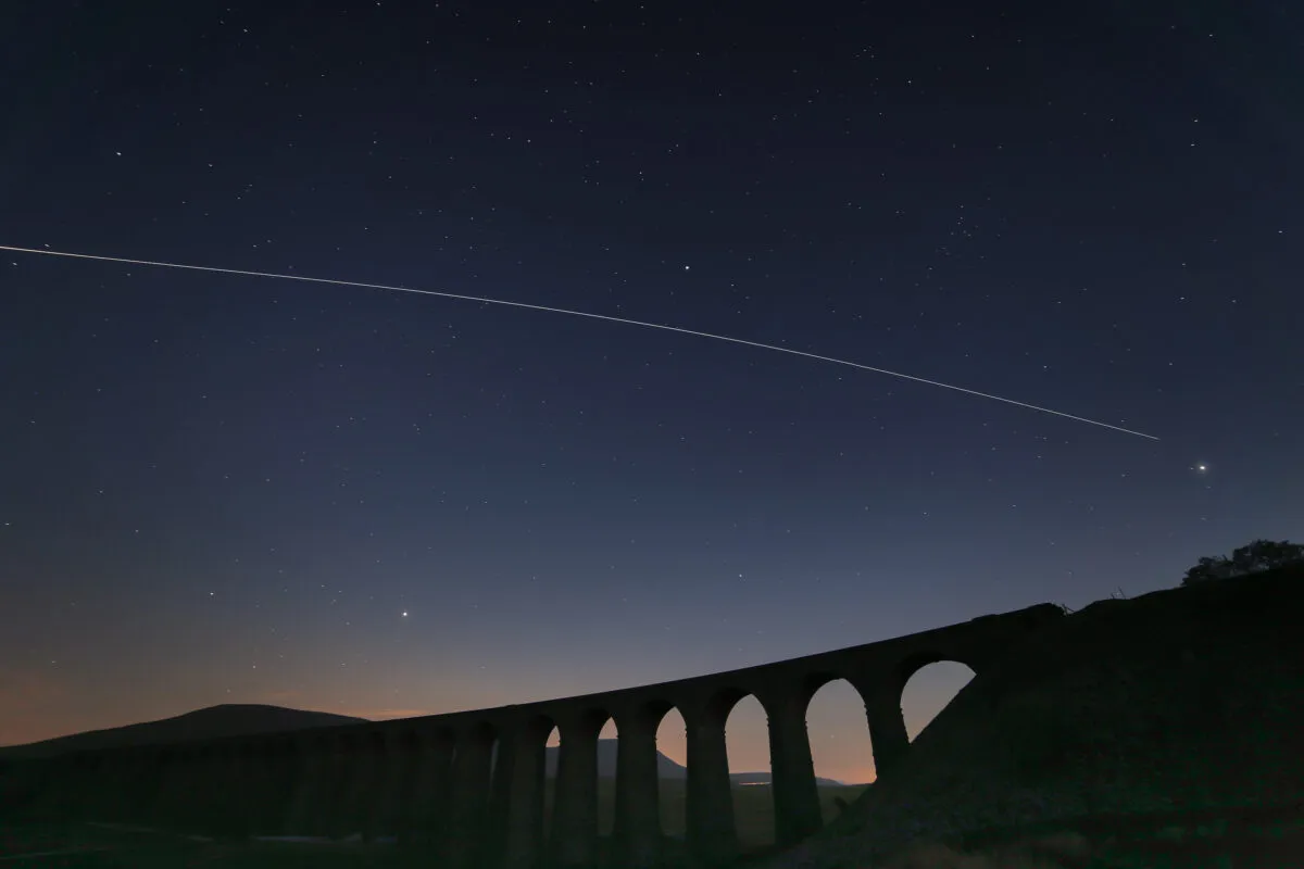 International Space Station over Ribblehead Viaduct, captured by Pete Collins, 2016. Canon 6D and Samyang 14mm f2.8 lens at f4, iso200. My image of the ISS passing over Ribblehead Viaduct, a famous landmark on the Settle to Carlisle railway line in the Yorkshire Dales. Behind the viaduct is Ingleborough, one of Yorkshire's Three Peaks. Also featuring Jupiter to the right of the viaduct and Mars and Saturn to the left of the viaduct. I took the shot just before midnight on 2 June, when the sky was still quite bright - and Tim Peake was still on board! This is a composite of 5 frames, because I limited the exposure to 30 seconds to avoid obvious trailing of the stars and planets, and didn't use a tracker to avoid blurring of the foreground. I actually took 6 frames but haven't included the first one in the final image because I thought it made a better composition with the ISS trail starting after it had passed Jupiter, so it gives more emphasis to Jupiter.