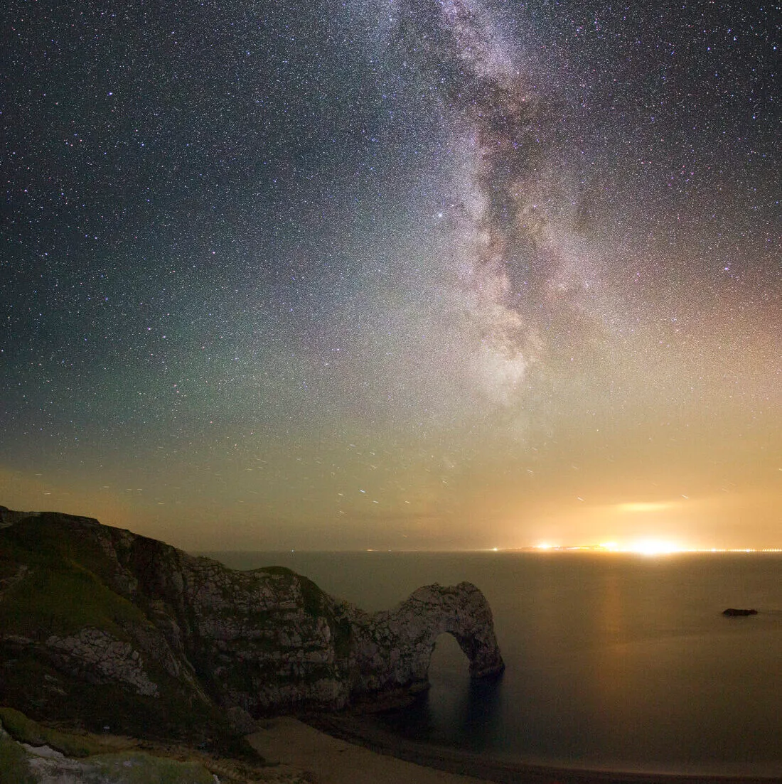 Milky Way over Durdle Door by Mark Pelleymounter, Dorset, UK. Equipment: Canon 7d, Sigma 10-20mm, Skywatcher Star Adventurer.