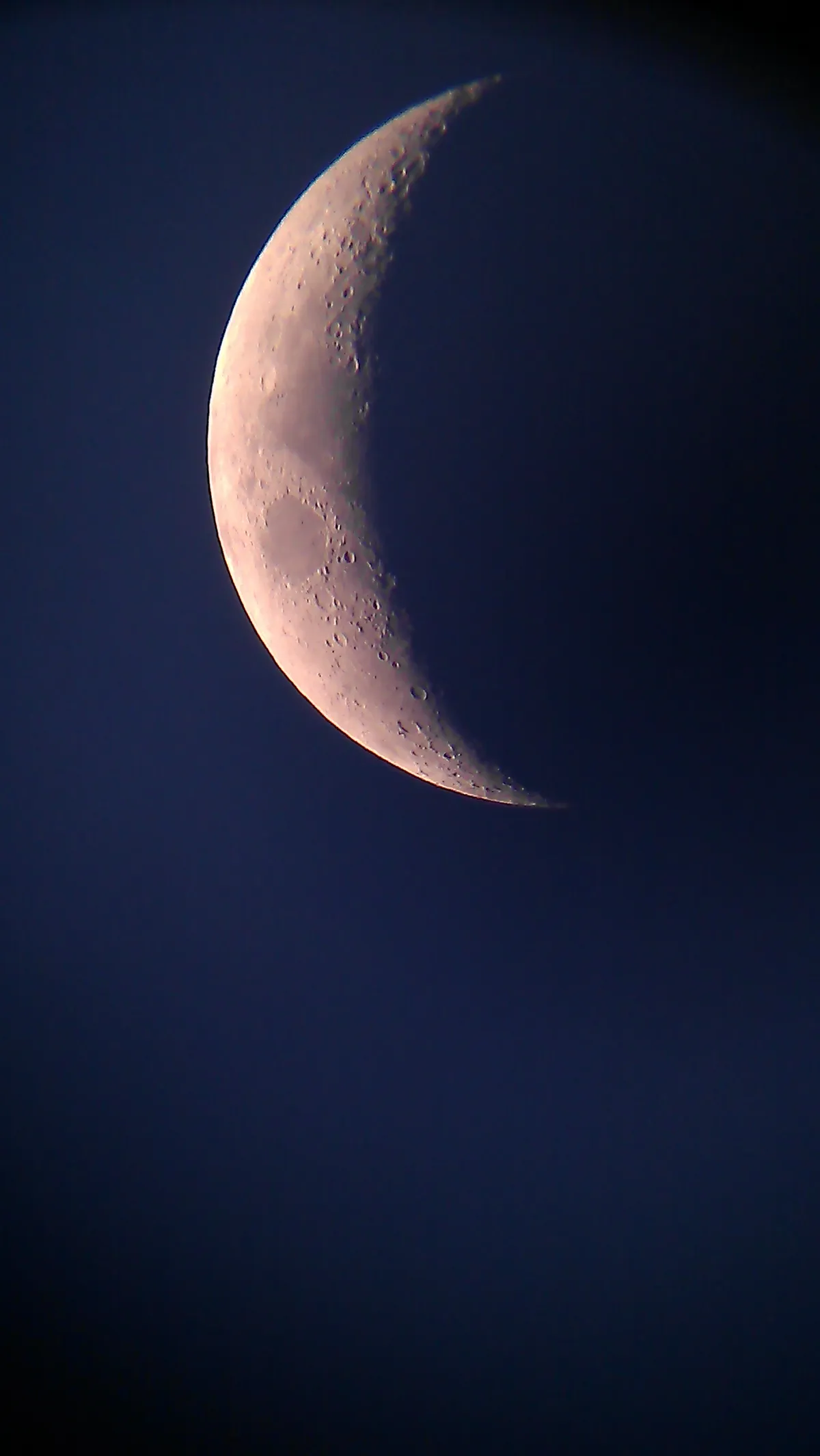 Waxing Crescent Moon (Laterally Inverted) by Callum Pennington, St. Helens, Merseyside. Equipment: Sky-Watcher BK 1309 EQ2 130mm Newtonian Reflector, super 25mm eyepiece, HookUpz Universal Adapter, Smartphone.