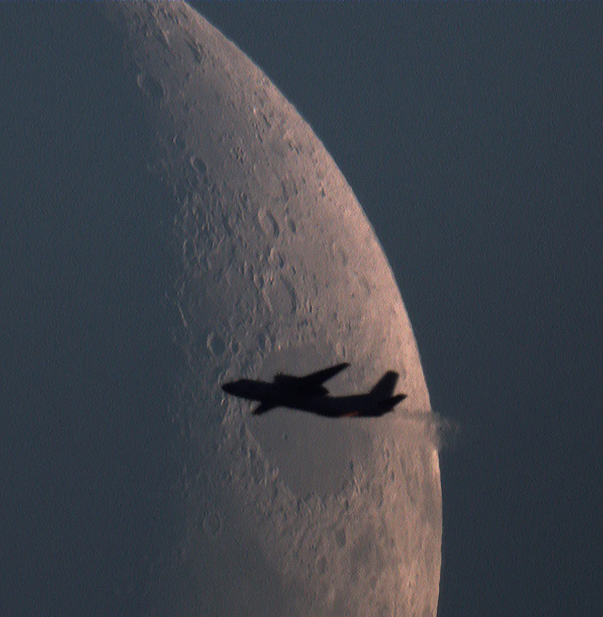 The Moon and Airplane by Dmitry Ardashev, Zaprudnya, Russia. Equipment: Sky-Watcher BK P2001 Newtonian reflector, HEQ5PRO equatorial mount, ZWO ASI178MC CCD Camera.