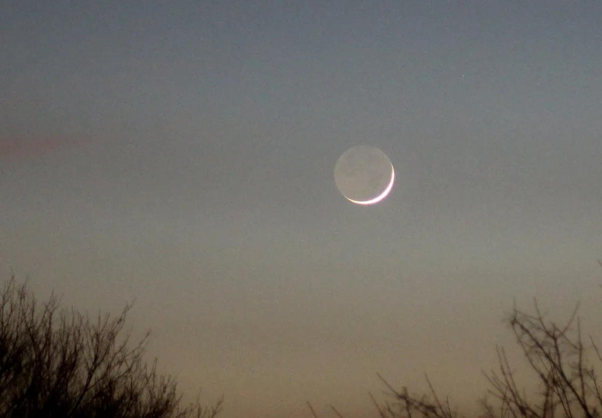Crescent Moon and Earthshine by Ron G, Stafford, UK. Equipment: Canon 1200D, tripod, Tamron 70-300mm lens