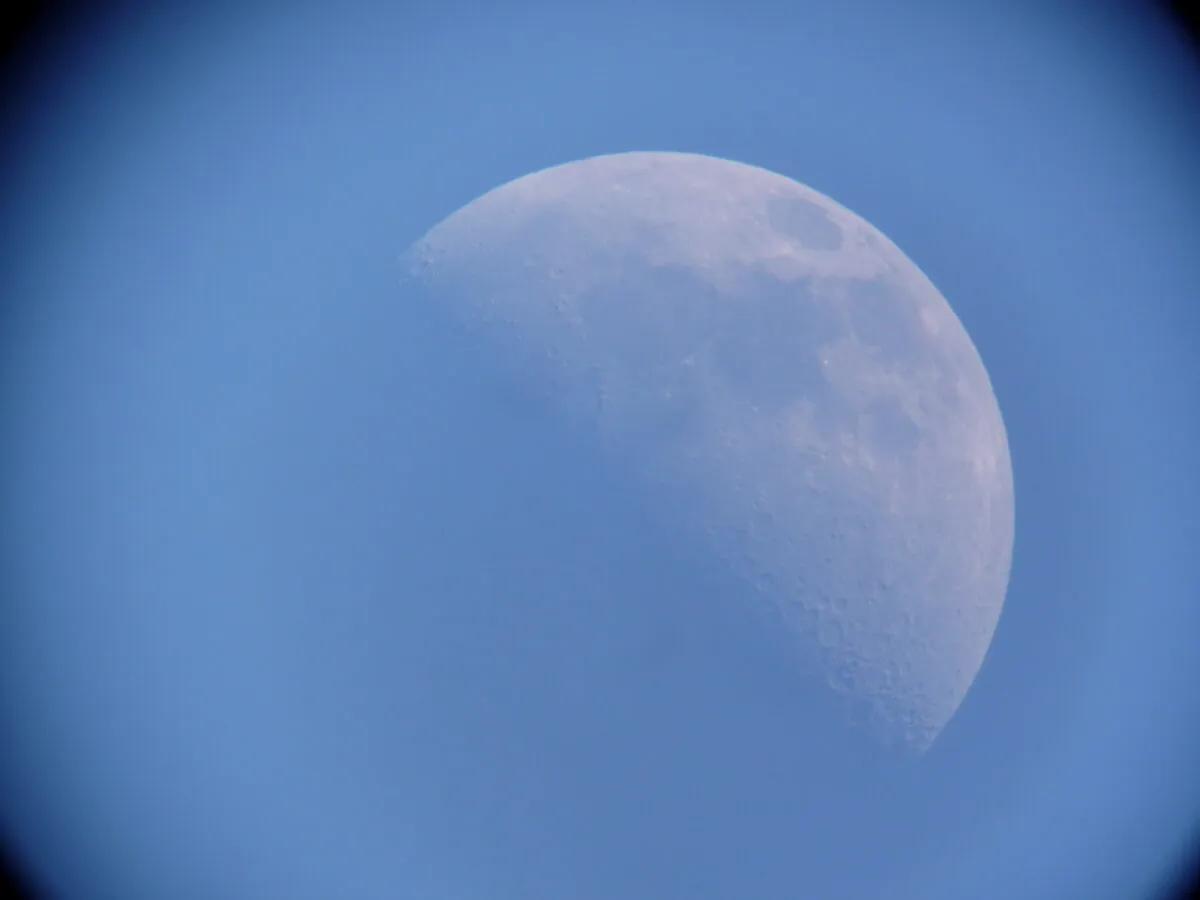 The bright blue of the cloudy daytime sky makes the Moon appear blue in this image captured by Jason Meadows from Kent, UK, 11 April 2011, using a Bresser Messier N-150, 25mm eyepiece, Panasonic Lumix TZ5.