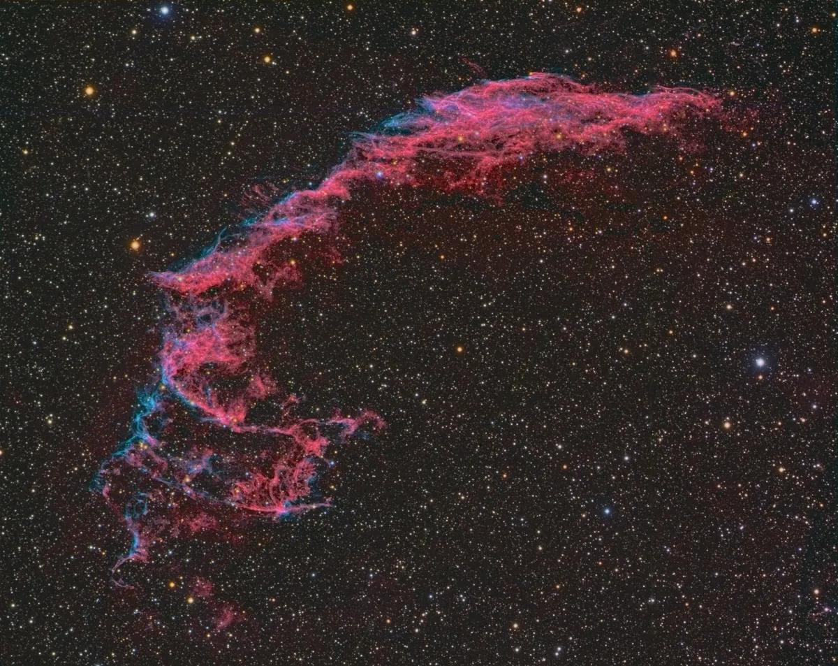 Eastern Loop of Veil Nebula by Jean M Dean Guernsey, Channel Islands. Equipment: Takahashi FSQ106, Starlight Xpress Trius 814 CCD, Baader RGBL and Ha filters and a Skywatcher AZ EQ6 GT mount.