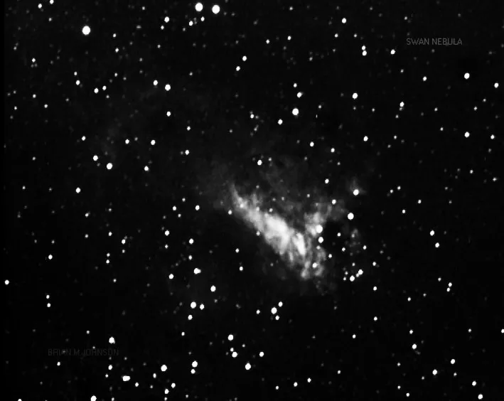 Swan Nebula by Brian.M.Johnson, Kelling Heath, UK. Equipment: Stellacam 3 NP127 refractor, analog video.