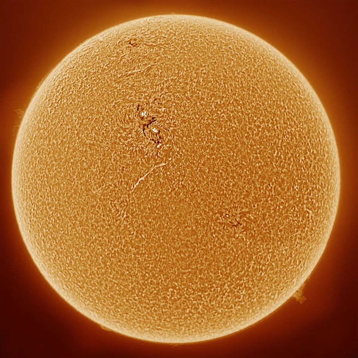 The Sun in Hydrogen-Alpha by Bill McSorley, Leeds, UK. Equipment: 70mm Tele-Vue refractor, Coronado Hydrogen Alpha filters, QHY5L-II colour planetary camera, Celestron Alt-Az mount.