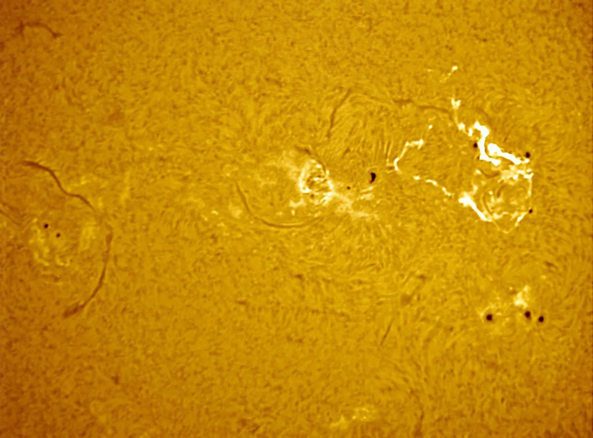 Sunspots & Medium Solar Flare by Mark Griffith, Swindon, Wiltshire, UK. Equipment: Lunt 35mm Ha Telescope, Skywatcher NEQ6 pro mount, 2x barlow and DMK41 mono camera.