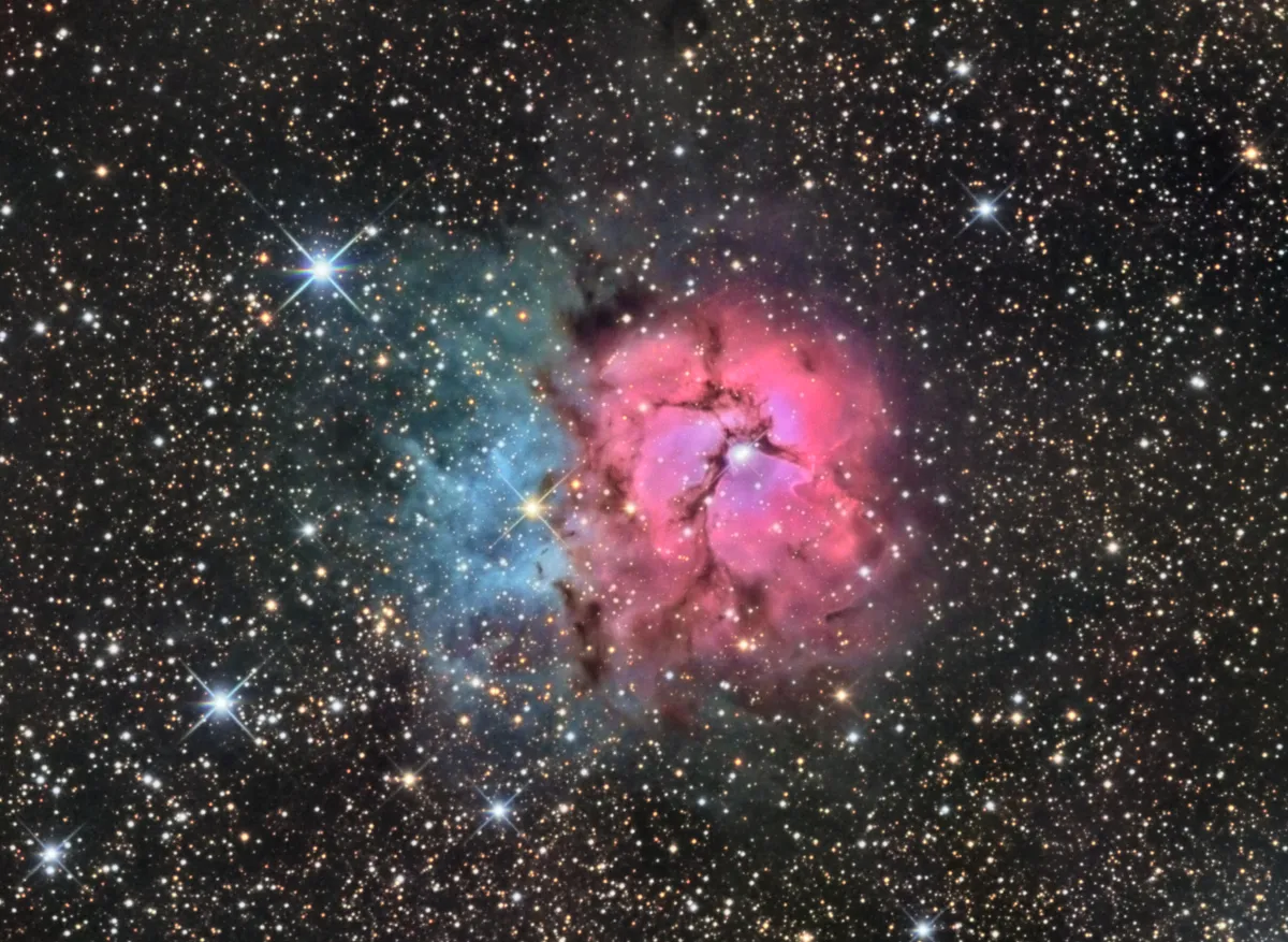 Trifid Nebula by Ron Brecher, Guelph, Ontario, Canada. Equipment: SBIG STL-11000M camera, Baader R, G and B filters, 10