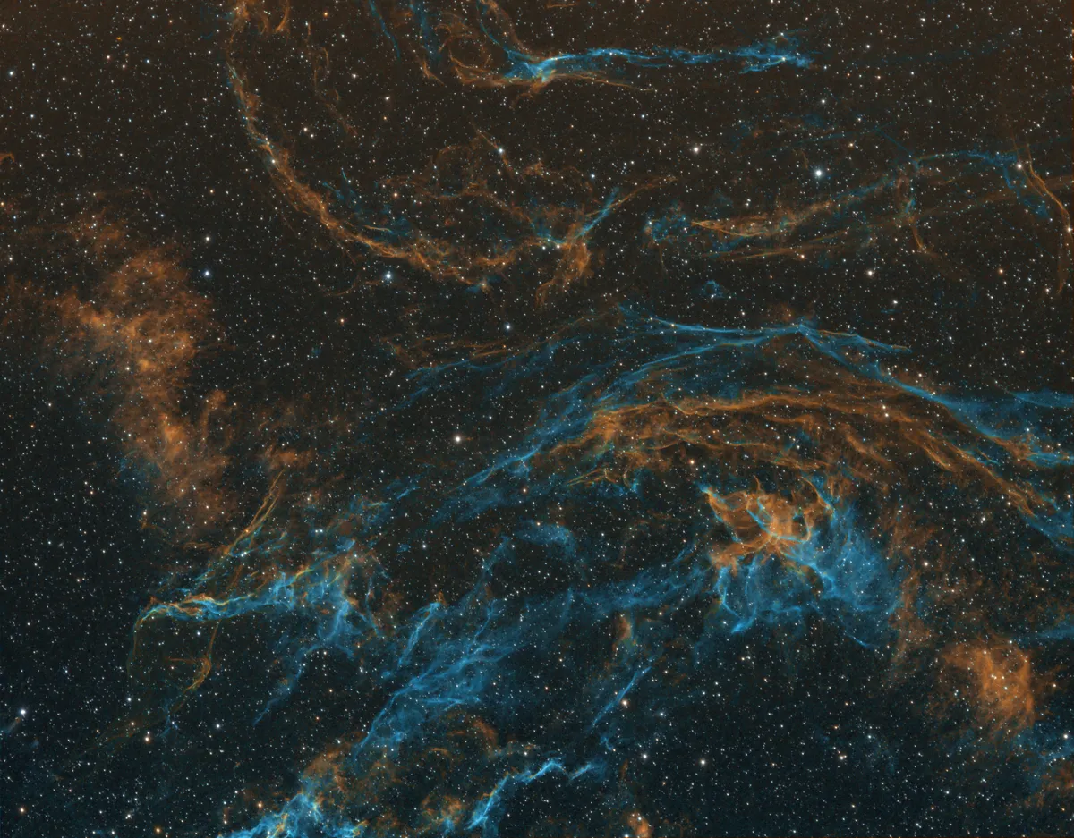 Veil Nebula (part) in HST by Chris Heapy, Macclesfield, UK. Equipment: Televue NP127is Refractor @ 660mm f/l, Atik490EX, 10-Micron GM2000HPS, unguided, 3nm Ha, OIII and SII (Astrodon)
