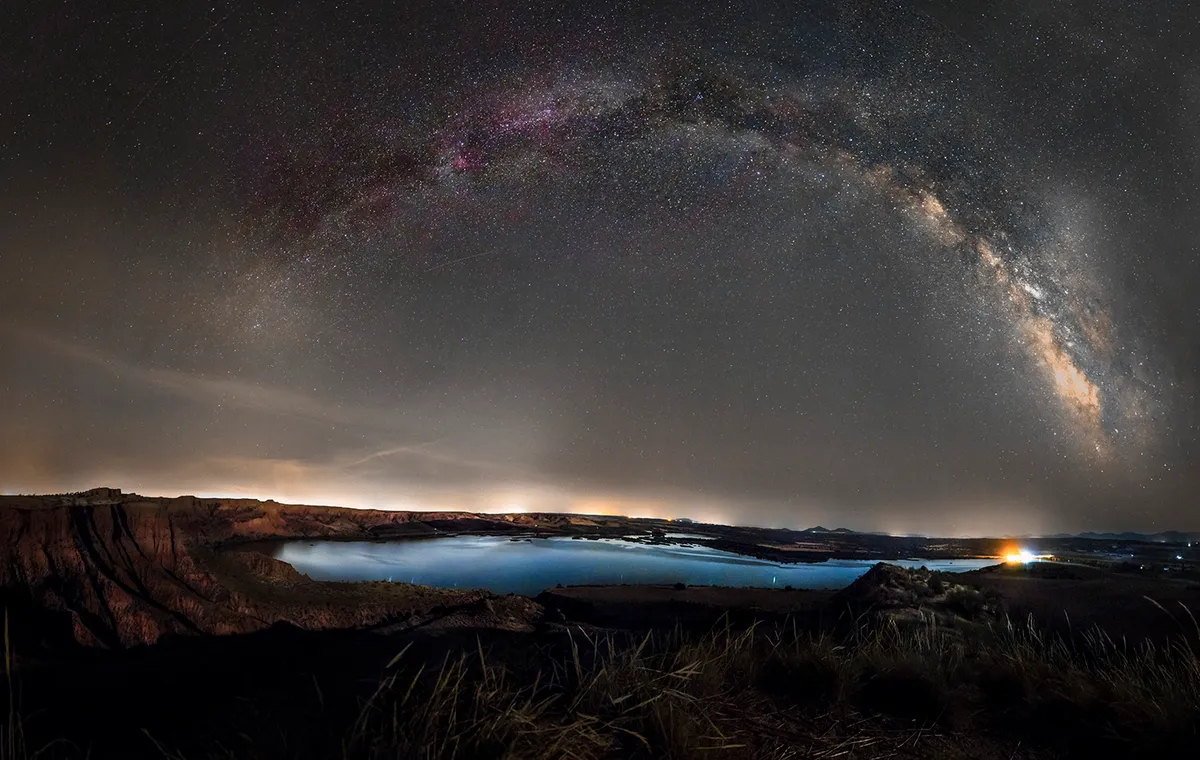 Panoramic Milky Way and h-alpha Regions by David Moreno Soler, Toledo, Spain. Equipment: Canon 550d, 18mm lens, Tripod.