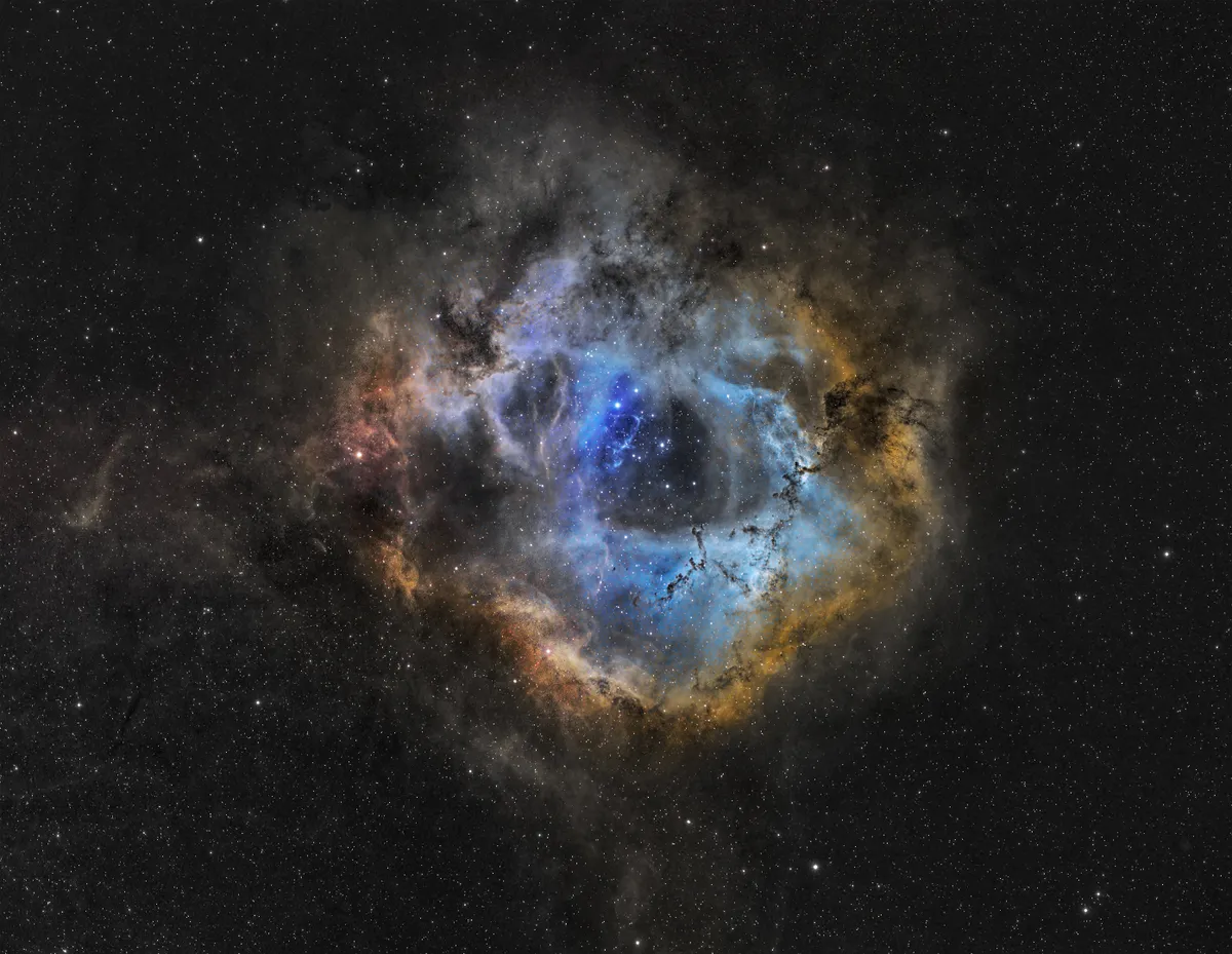 Rosette Nebula a Cosmic Cloud by Paul C. Swift, Spain. Equipment: Takahashi TSA 102, Starlight Express SXVR-H18, Sky-Watcher NEQ6 Pro, SX Loadstar, Takahashi TOA/FS Reducer, Baader Red 2", SII 8.5nm, B 2", G 2", O III 8.5nm, Ha 8.5nm