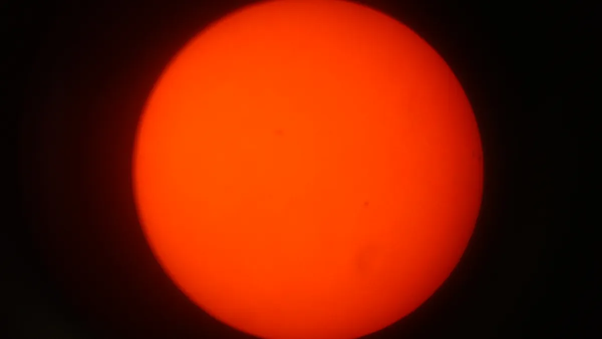 The sun with Orange Filter by Martin Davison, Middleton-St-George, Darlington, UK. Equipment: Celestron 127slt, Baader film, orange filter, smart phone
