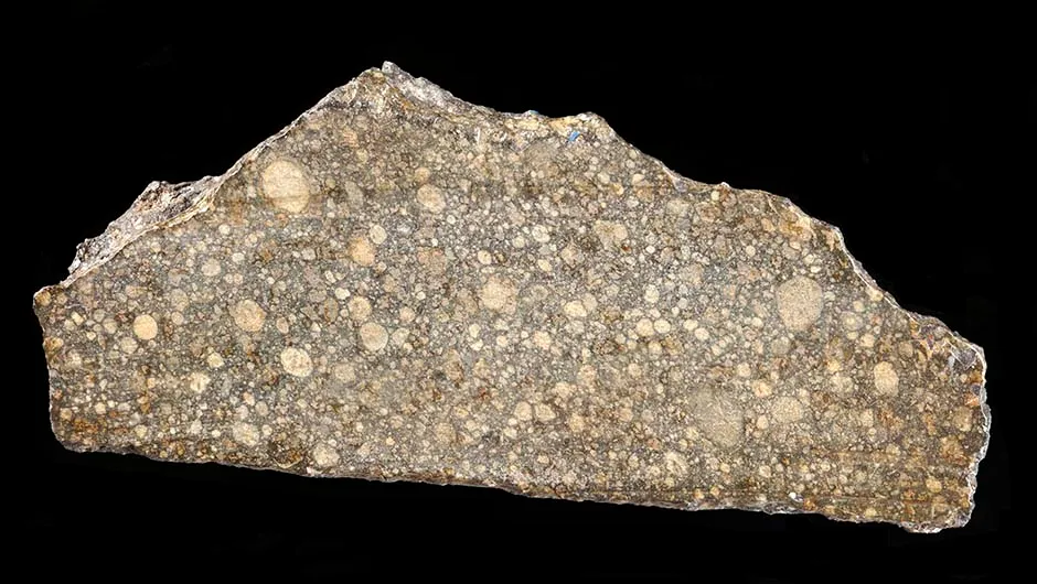 A small slice of the Beddgelert meteorite is on display at the National Museum of Wales in Cardiff, along with a model of the smaller Pontllyfni meteorite. In this image the scale bar is in millimetres and the specimen number is NMW 50.514.GR.1. Copyright: The National Museum of Wales