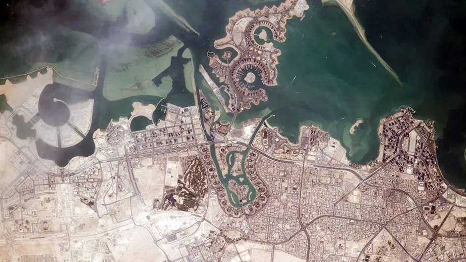 An image of Doha, the capital city of Qatar, in a photo taken from the International Space Station. Spaceflight has also allowed us to look back on our own planet and see humanity’s effect on the landscape. Credit: NASA