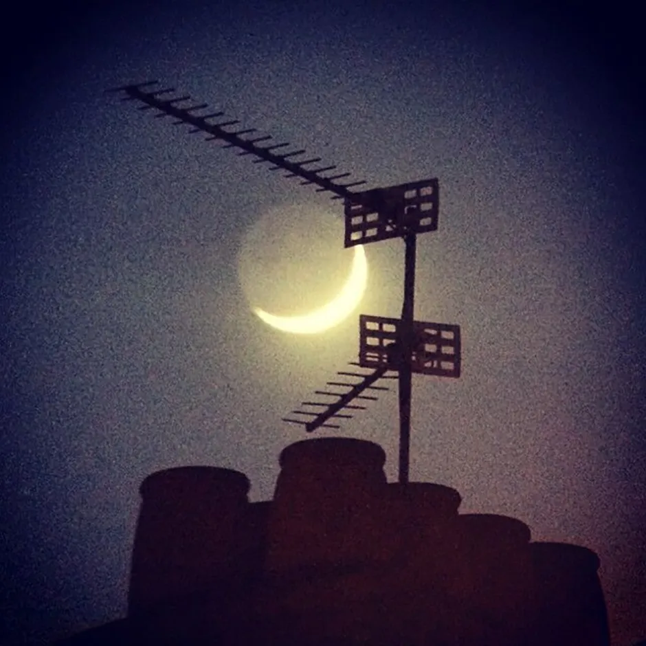 A Crescent Moon and Earth-shine through 10x70 binoculars, put through an Instagram filter