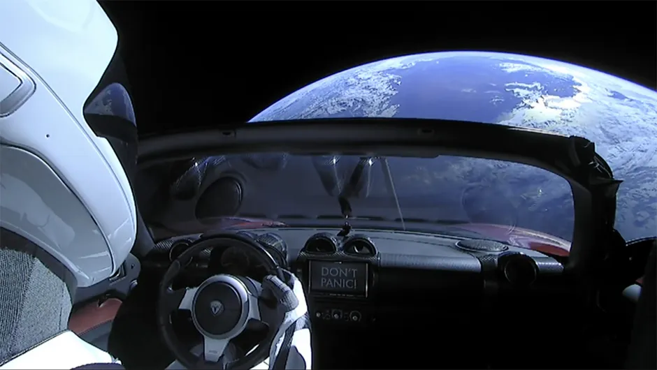 The Tesla Roadster was playing David Bowie while it floated by Earth, and mannequin driver Starman was kept safe from the vacuum in a custom spacesuit. Credit: Space X