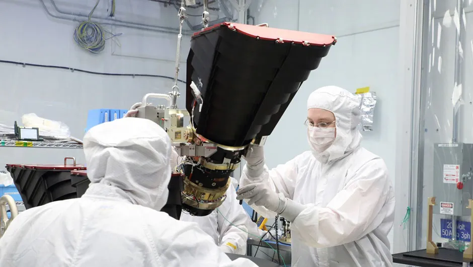 Scientists mount TESS’s cameras onto a camera plate at Orbital ATK in Dulles, Virginia, US, prior to its installation onto the spacecraft. Credit: Orbital ATK