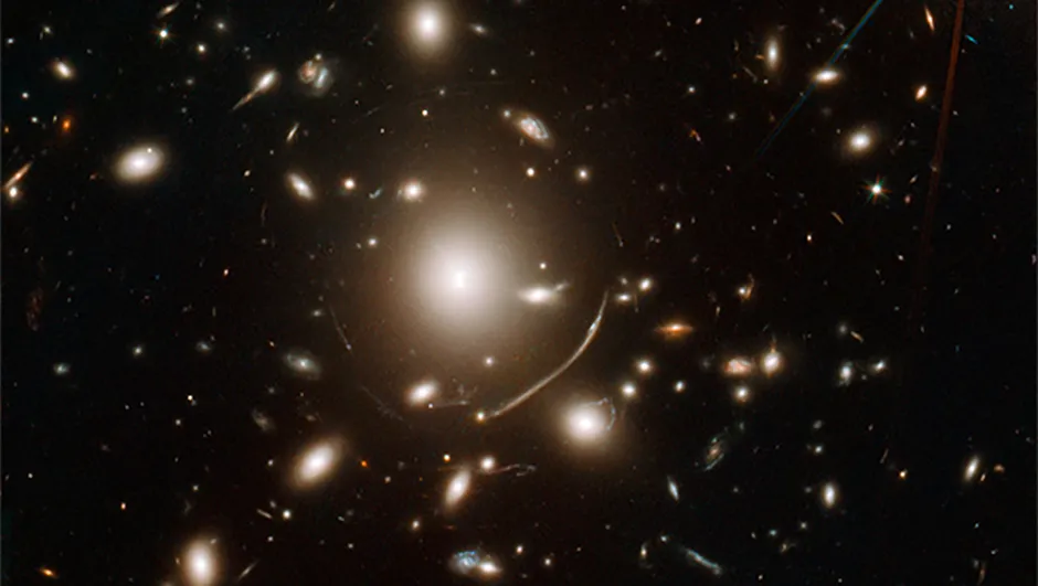 The swirls of light surrounding giant galaxy cluster Abell 383 at the centre of this image show gravitational lensing in action: the effects of massive objects on space-time. Credit: NASA, ESA, J. Richard (CRAL) and J.-P. Kneib (LAM). Acknowledgement: Marc Postman (STScI)