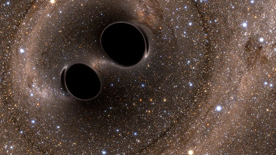 An artist's impression of two binary black holes in orbit around each other. The Andromeda-Milky Way collision will cause the central supermassive black holes to collide. Credit: The SXS (Simulating eXtreme Spacetimes)