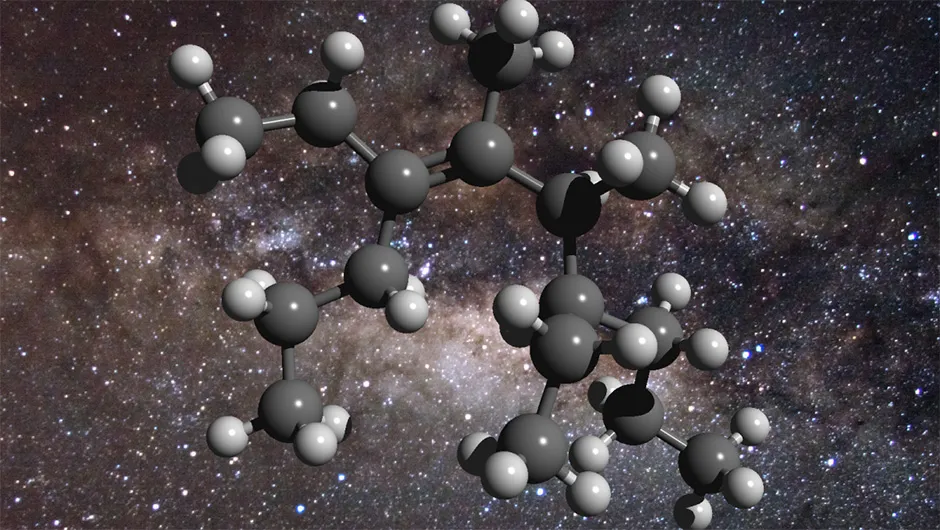 An illustration showing the structure of a ‘greasy’ carbon molecule, with a backdrop showing the centre of the Milky Way, where it has been detected. Carbon is represented with grey spheres and hydrogen with white. Credit: D. Young (2011), The Galactic Center. Flickr – CreativeCommons