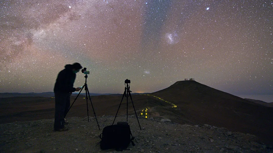 Action shot of the Ultra HD Expedition member Babak Tafreshi as he prepares his camera to capture the glittering canvas of the night sky. The red and green glow in the sky is due to airglow in the upper atmosphere. Image Credit: Babak TafreshiAction shot of the Ultra HD Expedition member Babak Tafreshi as he prepares his camera to capture the glittering canvas of the night sky. The red and green glow in the sky is due to airglow in the upper atmosphere. Image Credit: Babak Tafreshi