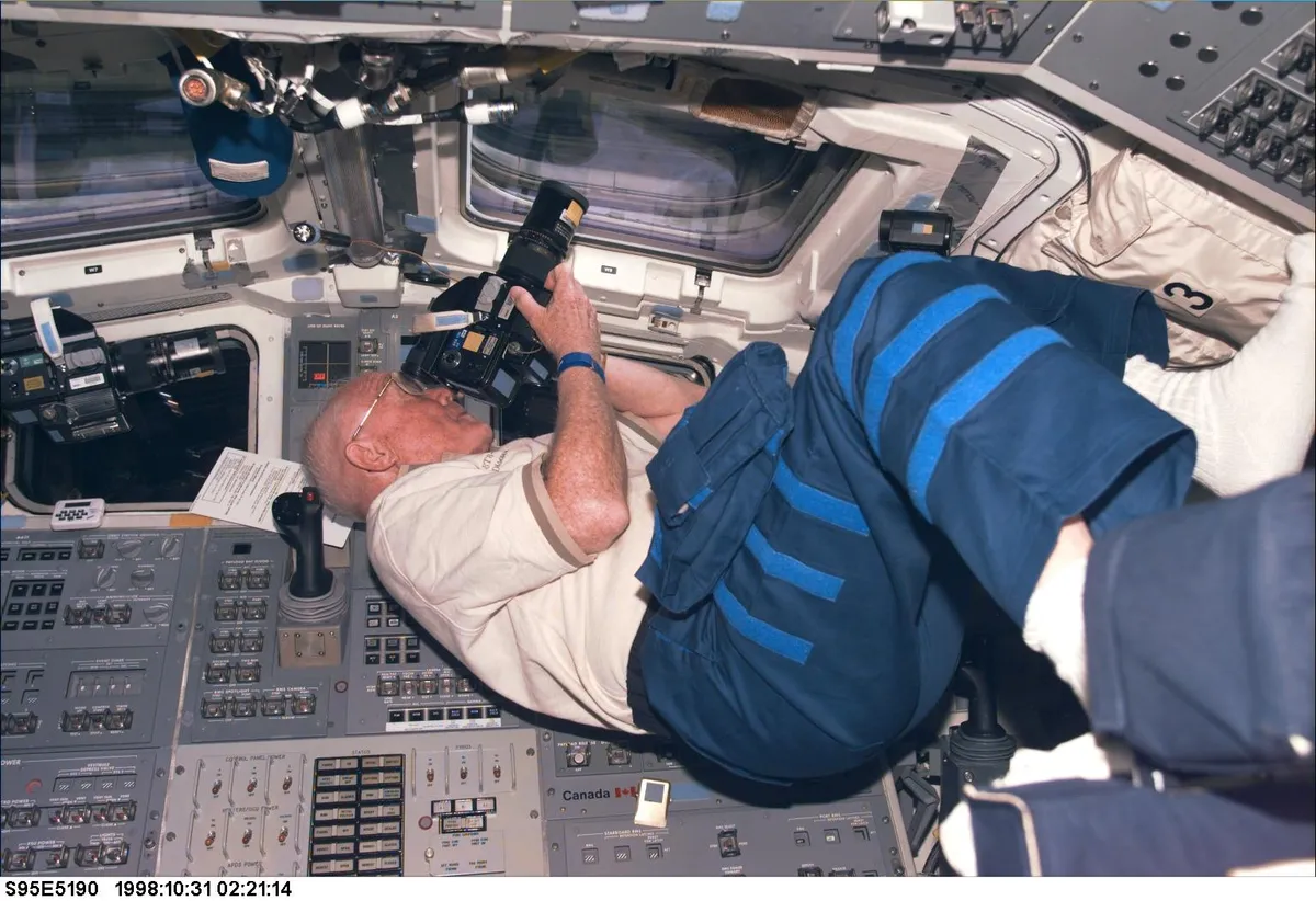 Participating in Earth observations onboard the Space Shuttle Discovery during the mission that made Glenn the oldest person to fly in space aged 77, 31 October 1998. (Credit: NASA)