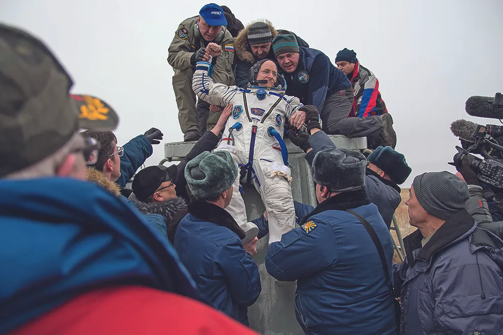 Scott Kelly is pulled out of the Soyuz by the Russian rescue forces after a year in space.