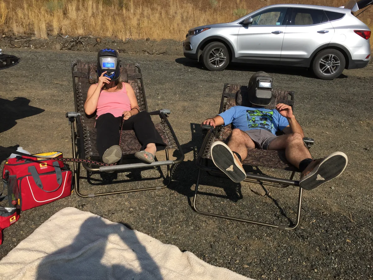 Welders' masks at the ready, totality begins! Credit: Nick Spall.
