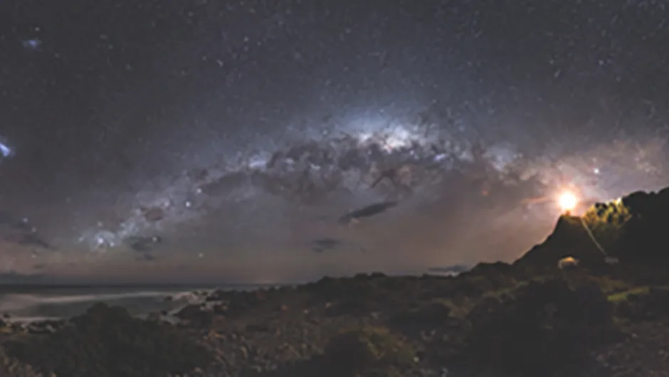 I recently spent a night out at Cape Palliser on the North Island of New Zealand photographing the night sky. I awoke after a few hours sleep at 5am to see the Milky Way low in the sky above Cape Palliser. The only problem was my camera gear was at the top of the lighthouse as seen in the right of this image. I had set up a time-lapse there a few hours before, so I had to climb the 250 plus steps up there to retrieve my gear before I could take this photo. By the time I got back the sky was beginning to get lighter with sunrise 2 hours away. I took a 360 degree pano, with this being crop of around 180 degrees of that.