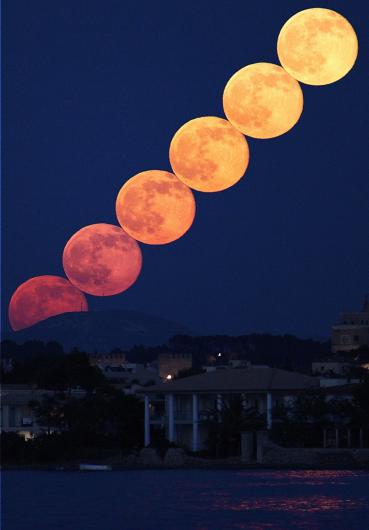 Full Moonrise Composite - Steve Knight, Taken from just outside Port de Pollenca in Majorca, the photographer set the camera to take images 2 seconds apart to create a timelapse. He then selected 6 images taken 140 seconds apart and stacked them using StarStax to get the effect of the moons just touching. The colour change in the rising moon illustrates a beautiful display of atmospheric Rayleigh scattering. 