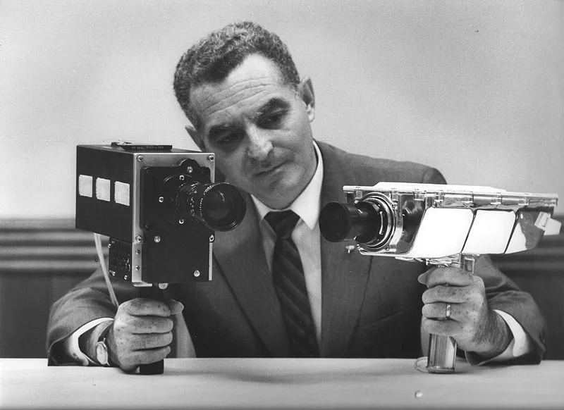 Stan Lebar is pictured holding two of Apollo's television cameras. On the left is the Field-Sequential Colour Camera and on the right the Monochrome Lunar Surface Camera, the very camera that caught Armstrong's first lunar steps on film. Credit: NASA