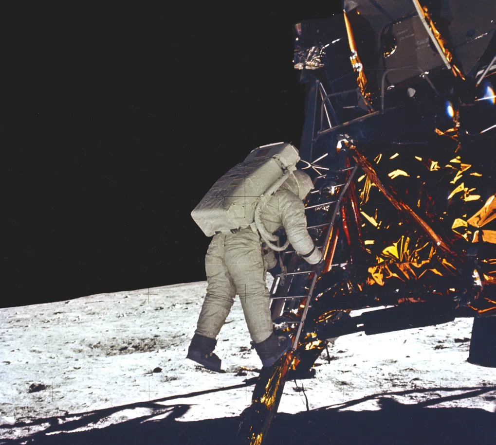 Buzz Aldrin descends the Lunar Module ladder to become the second person to walk on the Moon