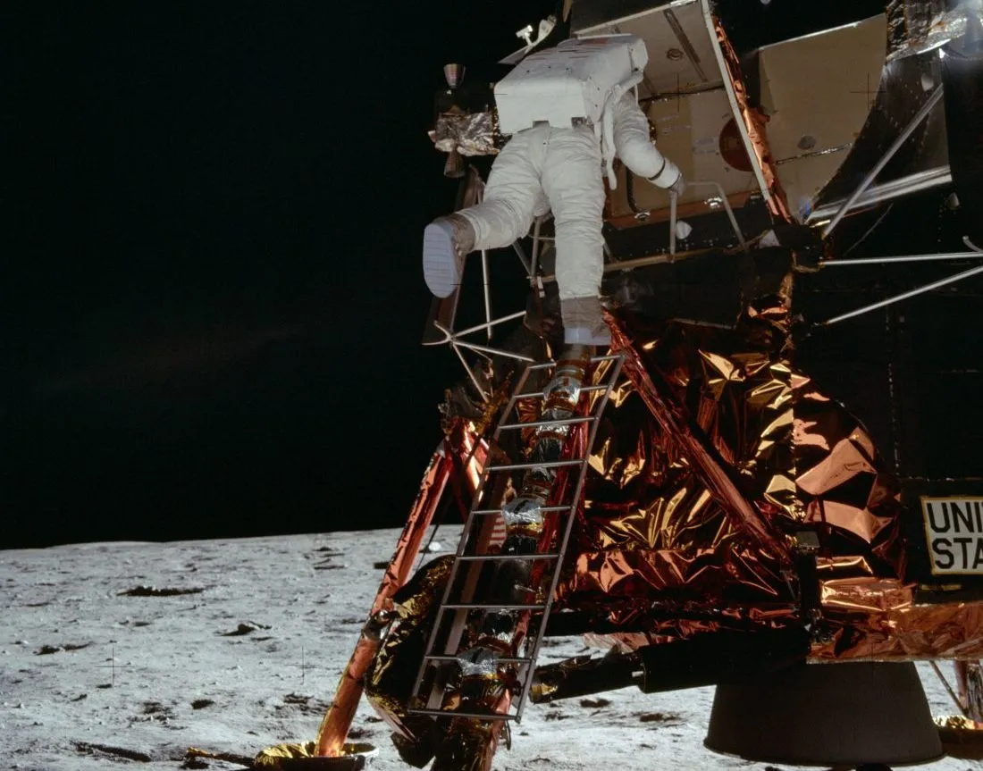 Buzz Aldrin descends the Lunar Module ladder to reach the surface of the Moon. Credit: NASA
