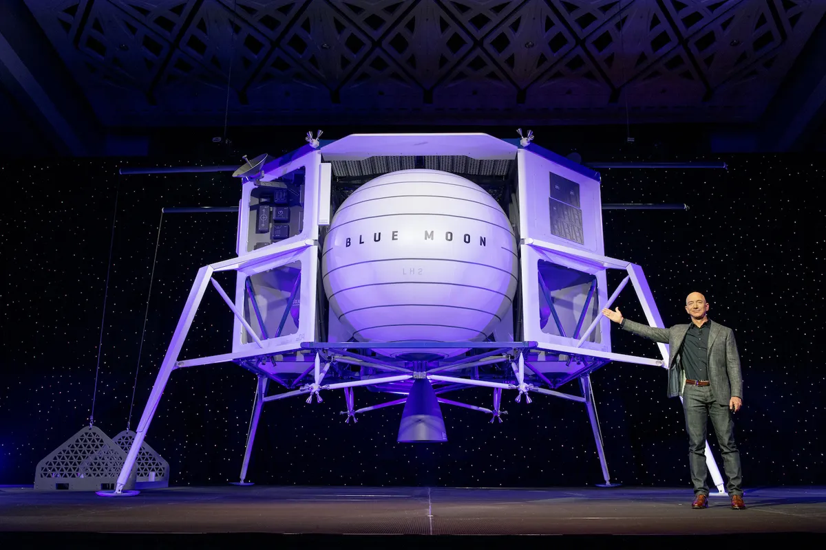 Jeff Bezos pictured with a model of Blue Origin's Blue Moon lunar lander. Credit: Blue Origin