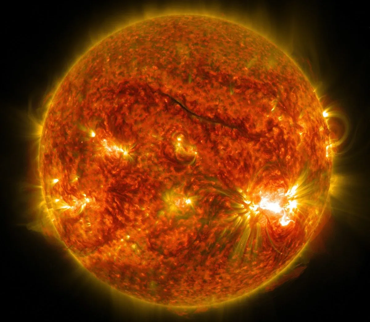 An image of the Sun showing solar flares erupting from its surface, the largest of which can be seen on the lower right. The image was captured by NASA's Solar Dynamics Observatory on 26 October 2014. Credit: NASA/SDO
