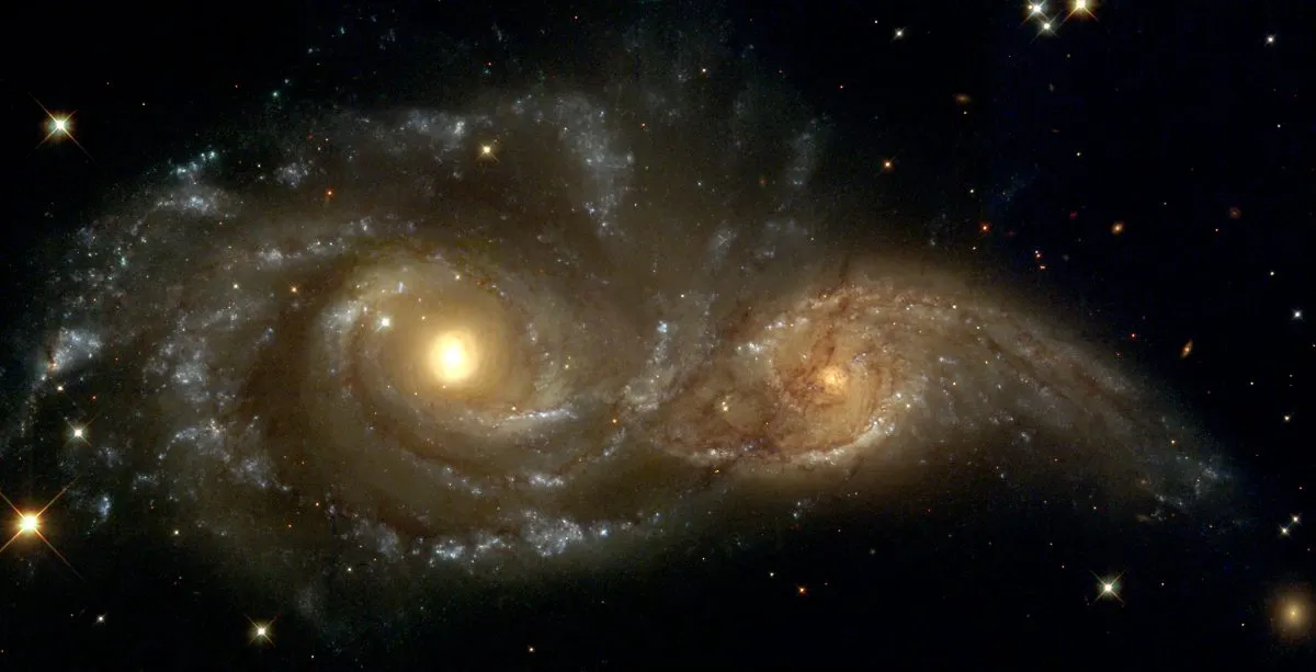 Merging galaxies NGC 2207 and IC 2163, as seen by the Hubble Space Telescope. Credit: NASA/ESA and The Hubble Heritage Team (STScI)