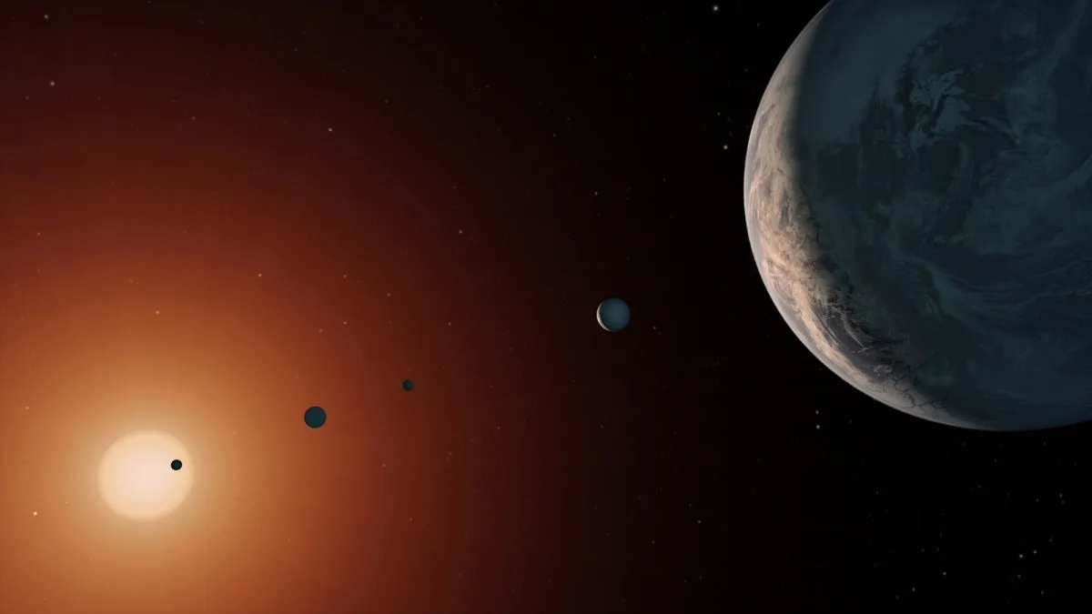 An artist's illustration of the TRAPPIST-1 system that was discovered by the Spitzer Space Telescope and the ground-based TRAPPIST telescope. Credit: NASA/JPL-Caltech